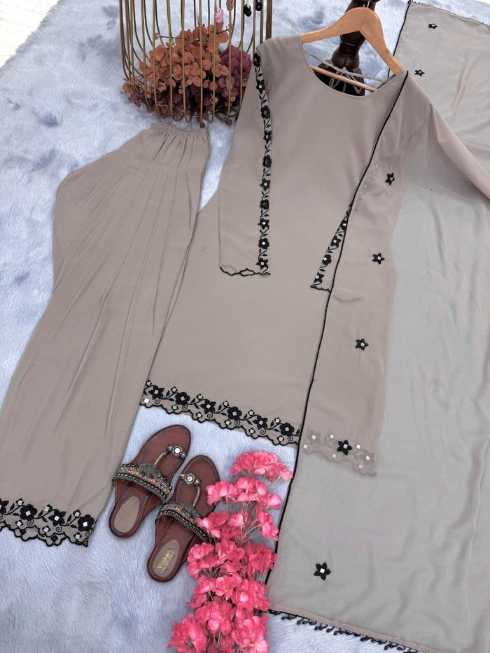 FASHION CAVE Elegant cream georgette set with embroidered mirror work top, palazzo pants, and matching dupatta for a graceful look.