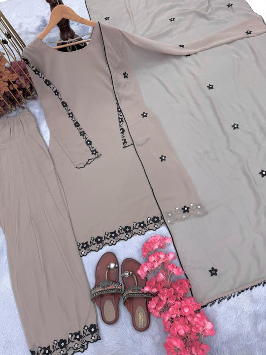 FASHION CAVE Elegant cream georgette set with embroidered mirror work top, palazzo pants, and matching dupatta for a graceful look.