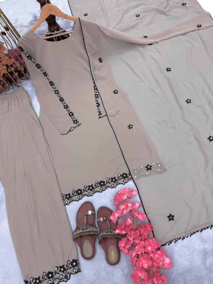 FASHION CAVE Elegant cream georgette set with embroidered mirror work top, palazzo pants, and matching dupatta for a graceful look.