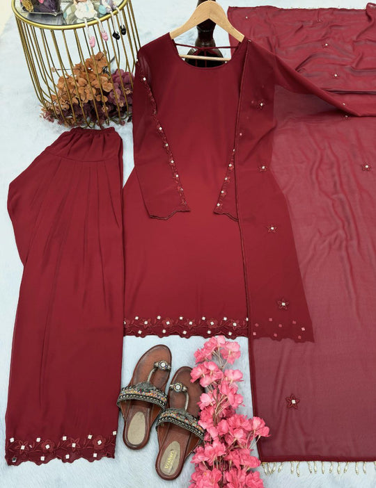 FASHION CAVE Elegant Mehroon georgette set with embroidered mirror work top, palazzo pants, and matching dupatta for a graceful look. (Copy)